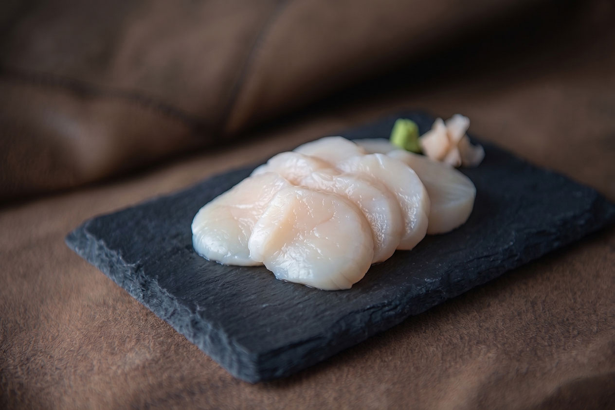 Kamskjell sashimi